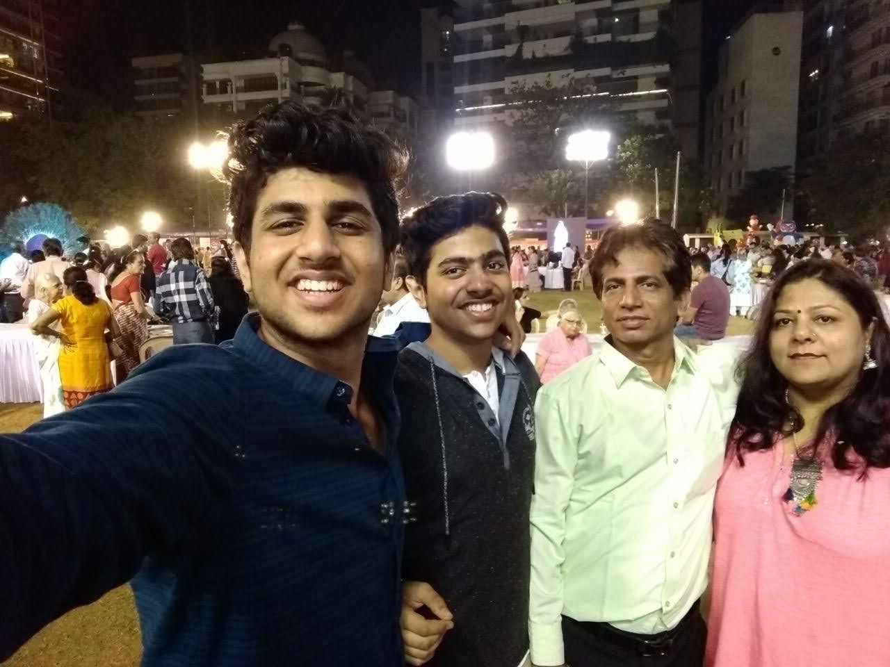 A picture from one of the fairs on an open crowd. Left to right: Aakash (brother), Tushar, Father, Mother.
